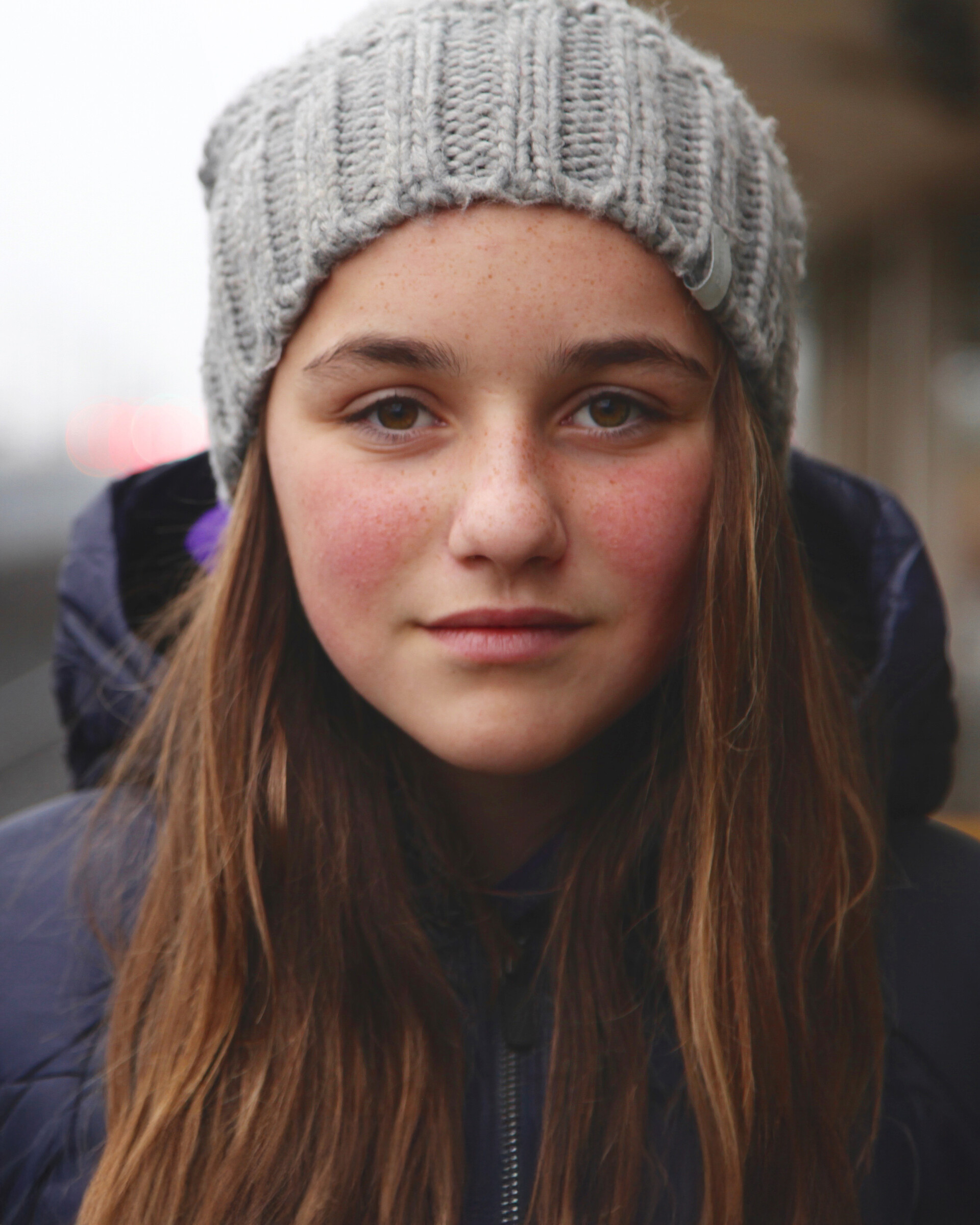 Urban portrait of a teenage girl smiling